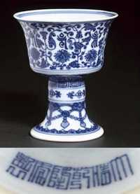 A blue and white stem cup